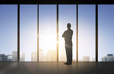 Image showing silhouette of business man over office background