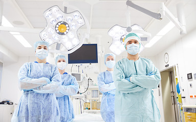 Image showing group of surgeons in operating room at hospital