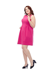 Image showing happy young plus size woman posing in pink dress