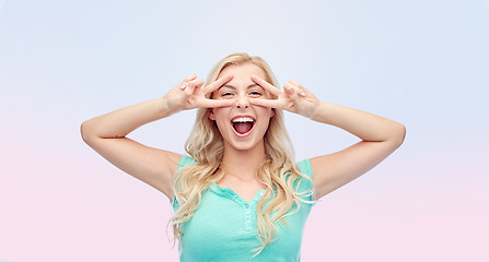 Image showing smiling young woman or teenage girl showing peace