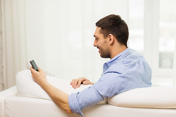 Image showing close up of man with smartphone at home