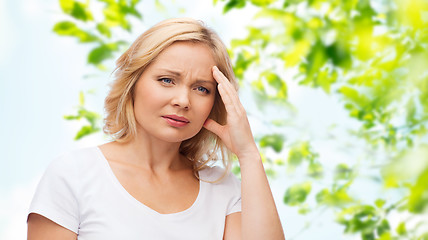 Image showing unhappy woman suffering from headache