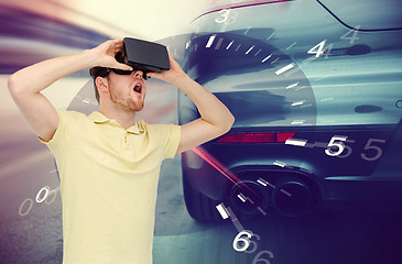 Image showing man in virtual reality headset and car racing game