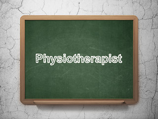 Image showing Medicine concept: Physiotherapist on chalkboard background