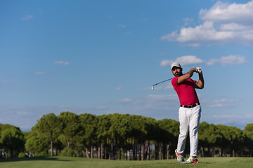 Image showing golf player hitting long shot