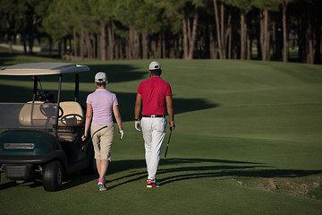 Image showing couple walking on golf course