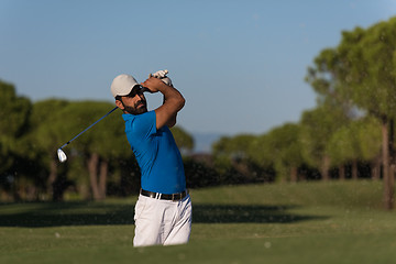 Image showing pro golfer hitting a sand bunker shot