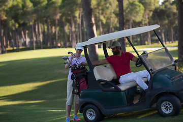 Image showing couple in buggy on golf course