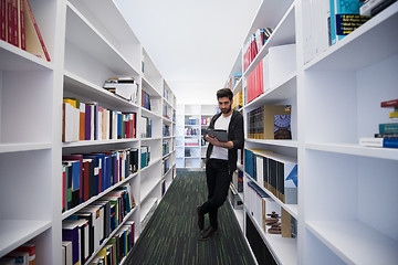 Image showing student with tablet in library