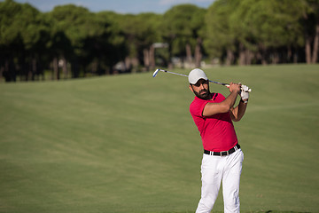 Image showing golfer hitting a sand bunker shot