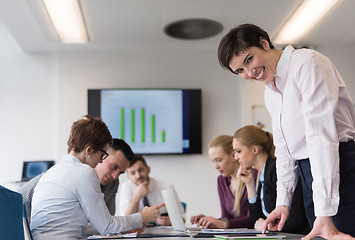 Image showing young  woman using  tablet on business meeting