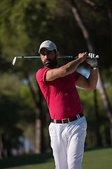 Image showing golfer hitting a sand bunker shot