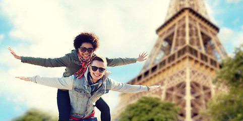 Image showing happy teenage couple over paris eiffel tower