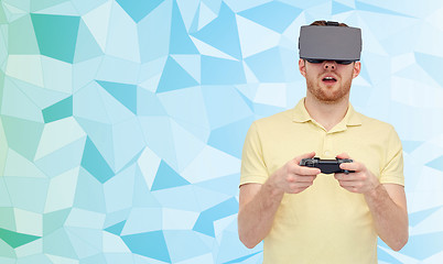 Image showing man in virtual reality headset with gamepad