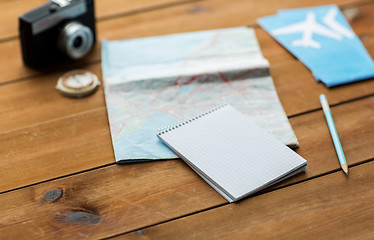 Image showing close up of notepad with map and travel tickets