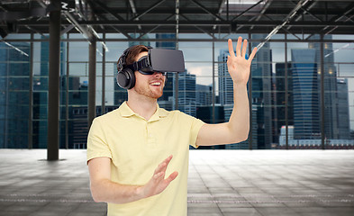 Image showing happy man in virtual reality headset or 3d glasses