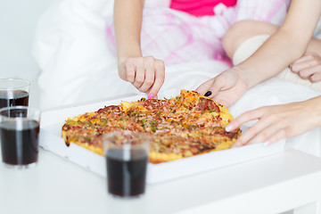 Image showing friends or teen girls eating pizza at home