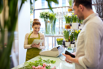 Image showing florist woman and man making order at flower shop