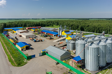 Image showing Corn dryer silos standing in machine yard