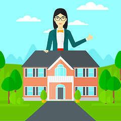 Image showing Real estate agent showing thumb up.