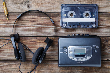 Image showing Music concept. Top view of cassette tape, audio player and headphones.