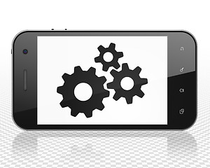 Image showing Advertising concept: Smartphone with Gears on display