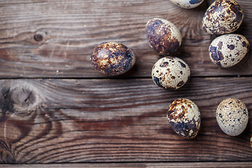 Image showing Group of quail eggs on thewooden background