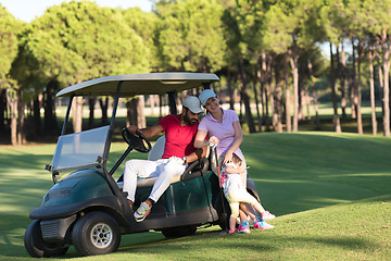 Image showing couple in buggy on golf course