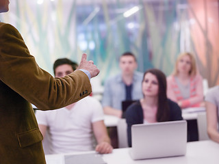 Image showing close up of teacher hand while teaching and explaining  lessons 