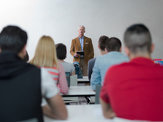 Image showing teacher with a group of students in classroom