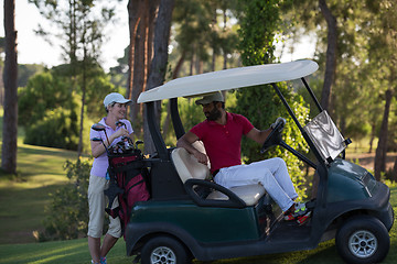 Image showing couple in buggy on golf course