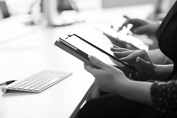 Image showing business people on meeting  using tablet computer