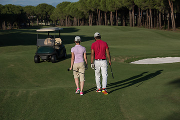 Image showing couple walking on golf course