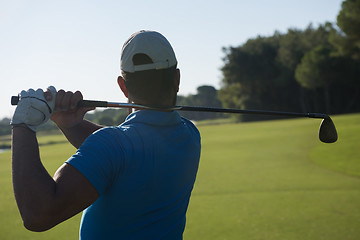 Image showing golf player hitting shot