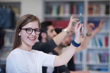 Image showing group of students  raise hands up