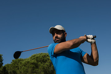 Image showing golf player hitting shot