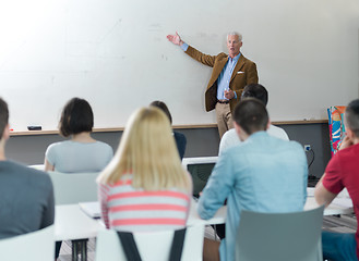 Image showing teacher with a group of students in classroom