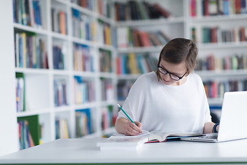 Image showing female student study in school library