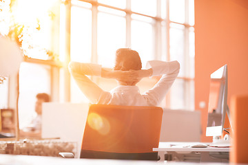 Image showing young business woman relaxing at workplace