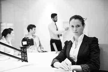 Image showing young business woman on meeting  using laptop computer