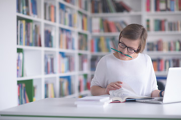 Image showing female student study in school library