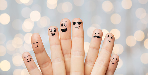 Image showing close up of hands and fingers with smiley faces