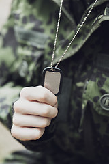 Image showing close up of young soldier in military uniform