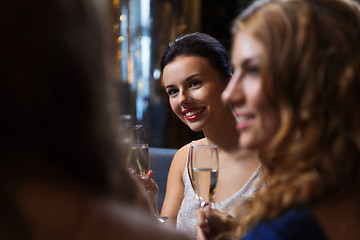 Image showing happy women with champagne glasses at night club