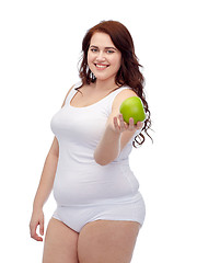 Image showing happy plus size woman in underwear with apple