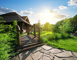 Image showing Bridge and house of log