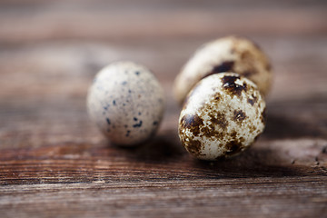 Image showing Group of quail eggs on thewooden background