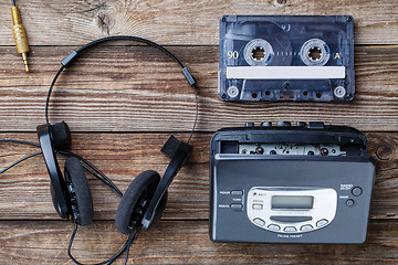 Image showing Music concept. Top view of cassette tape, audio player and headphones.