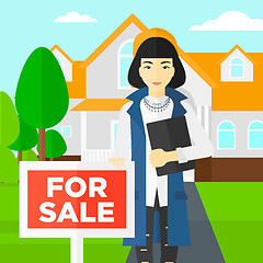 Image showing Real estate agent offering house.