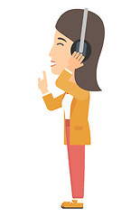 Image showing Woman listening music in headphones 